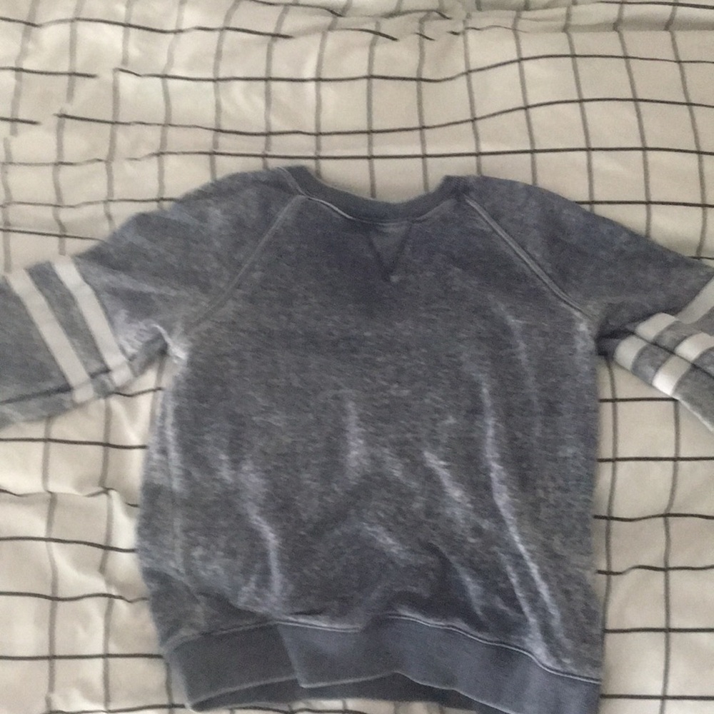 This is a blue and white sweater with stripes.